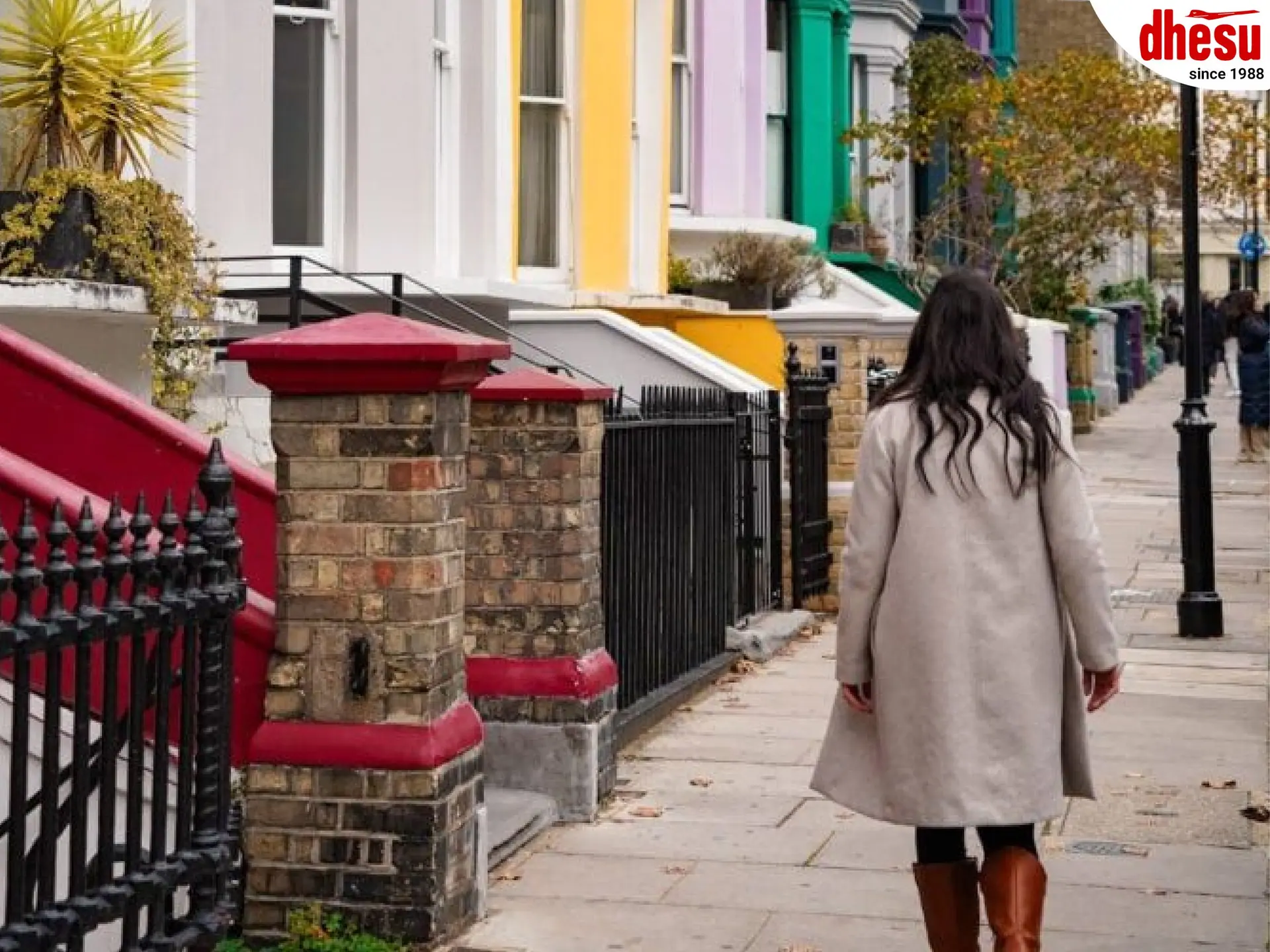 A person walking along a quiet residential street in a European city
