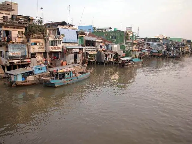 Mekong Delta sampan boat coconut palm waterway My Tho Vietnam