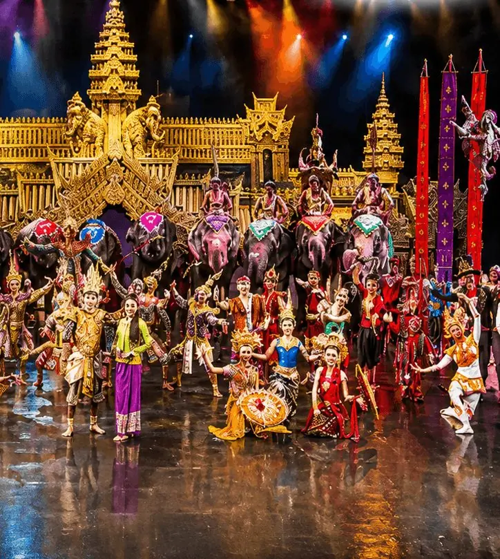 Costumed performers and elephants on stage at the Phuket FantaSea show