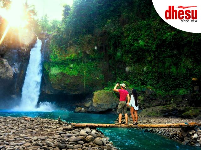Tegenungan Waterfall cascading into a natural jungle pool in Bali, Indonesia
